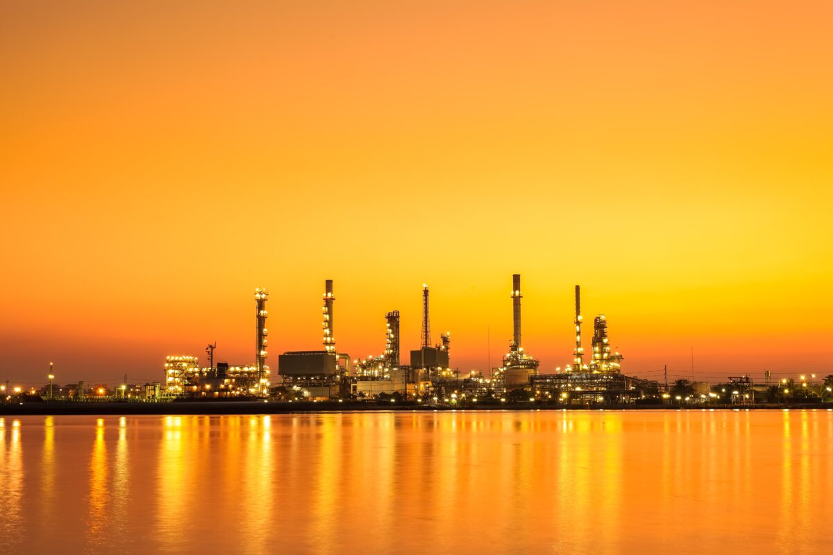 oil refinery at sunset